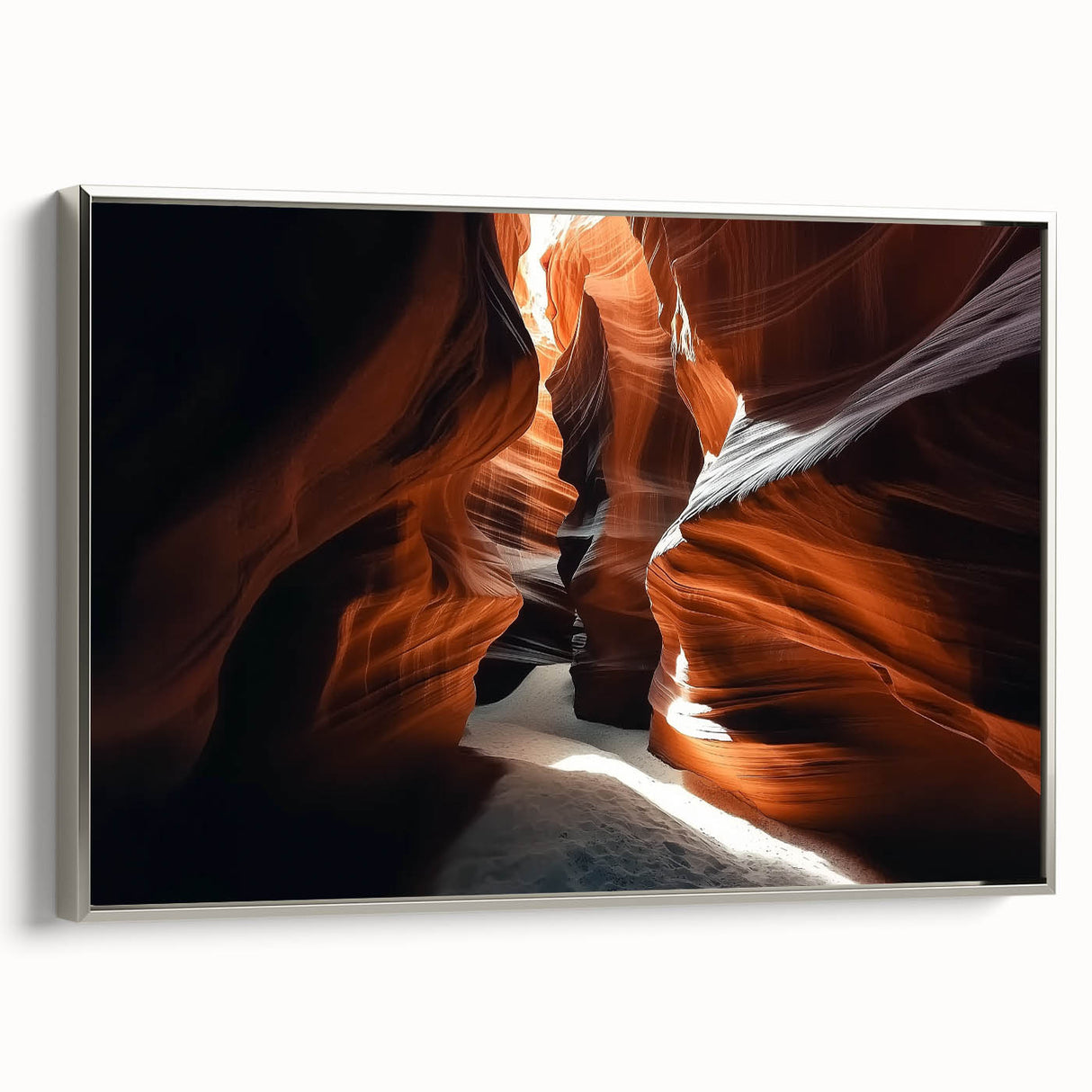 Framed canvas artwork depicting a stunning landscape of canyons, showcasing vibrant colors and intricate details, highlighted by a sleek silver frame, perfect for home decor.