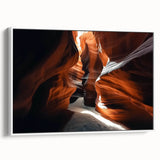 Framed canvas artwork depicting a stunning landscape of canyons, showcasing vibrant hues of orange and blue, designed to enhance any modern home decor.
