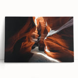 Stretched canvas print depicting a vibrant landscape of canyons at sunset, showcasing rich orange and purple hues, perfect for enhancing home decor.