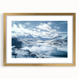 Gold-framed countryside landscape artwork with a white mat, showcasing vibrant green fields and a serene blue sky, perfect for home decor or gallery displays.
