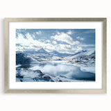 Silver-framed landscape artwork showcasing a serene countryside scene, featuring vibrant greens and soft blues, elegantly matted for a polished look. Ideal for home decor.