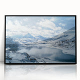 Framed acrylic artwork showcasing a serene countryside landscape with lush greenery, soft hills, and a tranquil sky, presented in a sleek black frame for elegant home decor.