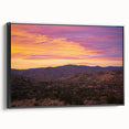 Framed canvas artwork showcasing a stunning desert landscape with vibrant colors and intricate details, featuring a sleek black frame for modern decor.