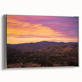 Framed canvas art depicting a stunning desert landscape with vibrant colors and intricate details, featuring a sleek silver frame that enhances its elegance.