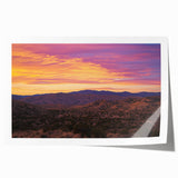 Desert landscape rolled canvas print showcasing vibrant orange and yellow hues, depicting a serene sunset over sand dunes, perfect for home decor.