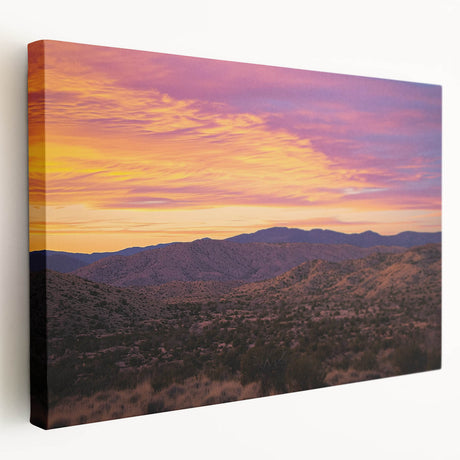 Stretched canvas artwork depicting a vibrant desert landscape in warm tones, featuring rolling dunes and a dramatic sunset, perfect for enhancing modern home decor.