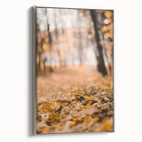 Framed canvas featuring a vintage-style landscape painting with autumnal trees in vibrant colors.