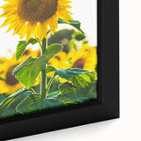 Framed canvas depicting a textured spring scene with vivid green and pink tones, ideal for living room decor.