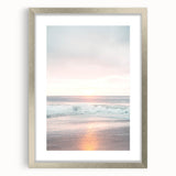 Textured abstract art print in warm orange and yellow tones, framed in silver, ideal for bedroom wall decor.