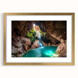 Framed gold landscape art print featuring a cave scene, accented with a white mat, ideal for home decor. Perfect for nature lovers and art enthusiasts.