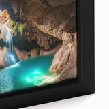 Close-up of a framed canvas artwork depicting a vibrant landscape with intricate cave formations, showcasing rich textures and earthy colors, perfect for home decor.