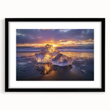 Black-framed landscape artwork depicting a serene beach scene with gentle waves and golden sand, elegantly matted for an enhanced aesthetic appeal.