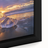 Framed canvas artwork showcasing a vibrant beach landscape with soft waves and golden sand, perfect for coastal decor enthusiasts looking to enhance their living space.