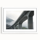 White landscape bridge frame with a mat, showcasing a serene view of a bridge surrounded by lush greenery, ideal for home decor and art enthusiasts.