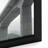 Close-up of a beautifully framed canvas depicting a serene landscape bridge scene, showcasing vibrant colors and intricate textures, ideal for home decor.