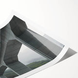 Rolled print showcasing a stunning landscape bridge illustration with vibrant colors and intricate details, designed for wall decor, presented in a protective tube.