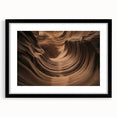 Framed landscape artwork showcasing vibrant canyons in rich earth tones, featuring a sleek black mat and frame, ideal for enhancing home decor and art collections.