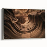 Framed canvas art featuring a stunning landscape of canyons in earthy tones, set in a sleek silver frame, perfect for enhancing modern home decor.