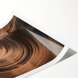 Stunning landscape print showcasing vibrant canyons in warm earth tones, rolled and ready for display, perfect for enhancing home decor with a natural theme.