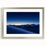 Framed desert landscape artwork with a silver mat and frame, showcasing warm tones of sand and sunset, ideal for home decor and enhancing interior spaces.