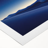 Vibrant rolled canvas artwork depicting a serene desert landscape at sunset, featuring warm hues of orange and yellow, ideal for enhancing home decor.