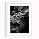 Abstract art print featuring close-up natural elements in muted earth tones, displayed in a white frame with mat.