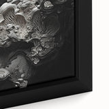 Close-up of textured black wall art with colorful abstract elements on a large framed canvas, suitable for living room decor.