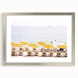 Textured abstract art print in muted gray and blue tones, framed in silver, ideal for modern bedroom ambiance.