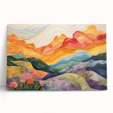 Abstract wall art featuring vibrant strokes in shades of blue, orange, and yellow on stretched canvas, leaning against a neutral-toned wall, adding a modern touch to any decor.