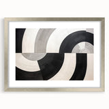 Abstract wall art featuring colorful strokes in a silver frame with a mat, showcasing a modern design ideal for contemporary home decor.