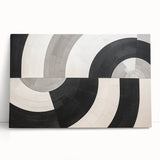 Abstract wall art canvas featuring vibrant strokes in shades of blue, pink, and gold, elegantly leaning against a neutral wall, enhancing modern decor aesthetics.