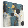Abstract strokes wall art on stretched canvas showcases vibrant hues of blue, gold, and white, adding a modern artistic touch to any interior decor.