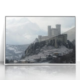 Framed acrylic artwork showcasing a picturesque landscape with a majestic castle surrounded by lush greenery and a clear blue sky, ideal for home decor.