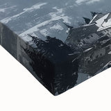 Close-up of a stretched canvas showcasing a vibrant landscape painting of a majestic castle set against a colorful sunset, highlighting intricate details and textures.