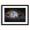 Framed landscape artwork showcasing a cave scene with a mat in a sleek black frame, ideal for modern home decor and art enthusiasts seeking unique wall displays.