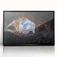 Framed black acrylic landscape artwork showcasing intricate cave formations, set against a sleek modern backdrop, perfect for contemporary home decor.