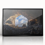 Framed black acrylic landscape artwork showcasing intricate cave formations, set against a sleek modern backdrop, perfect for contemporary home decor.
