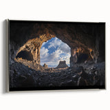 Framed canvas artwork showcasing a stunning landscape with cave formations, featuring a silver frame that enhances the piece's elegance, ideal for home decor.
