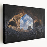 Side view of a stretched canvas depicting a vibrant landscape with caves, showcasing rich colors and intricate details, ideal for home decor or art enthusiasts.