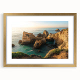 Elegant gold-framed landscape art print showcasing dramatic cliffs against a serene sky, perfect for enhancing home decor with a touch of sophistication.