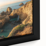 Close-up view of a framed canvas showcasing a dramatic cliff landscape with vibrant colors and intricate details, ideal for modern home decor. This artwork adds a touch of nature and sophistication to any interior space.