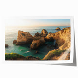 Stunning landscape print showcasing majestic cliffs against a vibrant sunset, rolled for easy shipping and display, perfect for home or office decor.