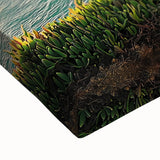 Close-up of a stretched canvas art piece showcasing a dramatic cliff landscape with vibrant colors and intricate details, perfect for enhancing home decor and artistic spaces.