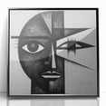 Framed abstract figurative wall art featuring bold black and white shapes, mounted in a sleek acrylic frame, ideal for modern home decor.