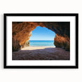 Black-framed landscape artwork depicting serene beaches with soft waves and clear skies, featuring a white mat for an elegant presentation, perfect for coastal decor.