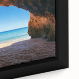 Close-up of a framed canvas showcasing a vibrant beach landscape with soft waves and golden sand, perfect for coastal-themed home decor. Ideal for enhancing living spaces.