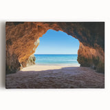 Stretched canvas artwork depicting a serene beach landscape with gentle waves, soft sand, and a vibrant sunset, perfect for home decor and coastal-themed interiors.