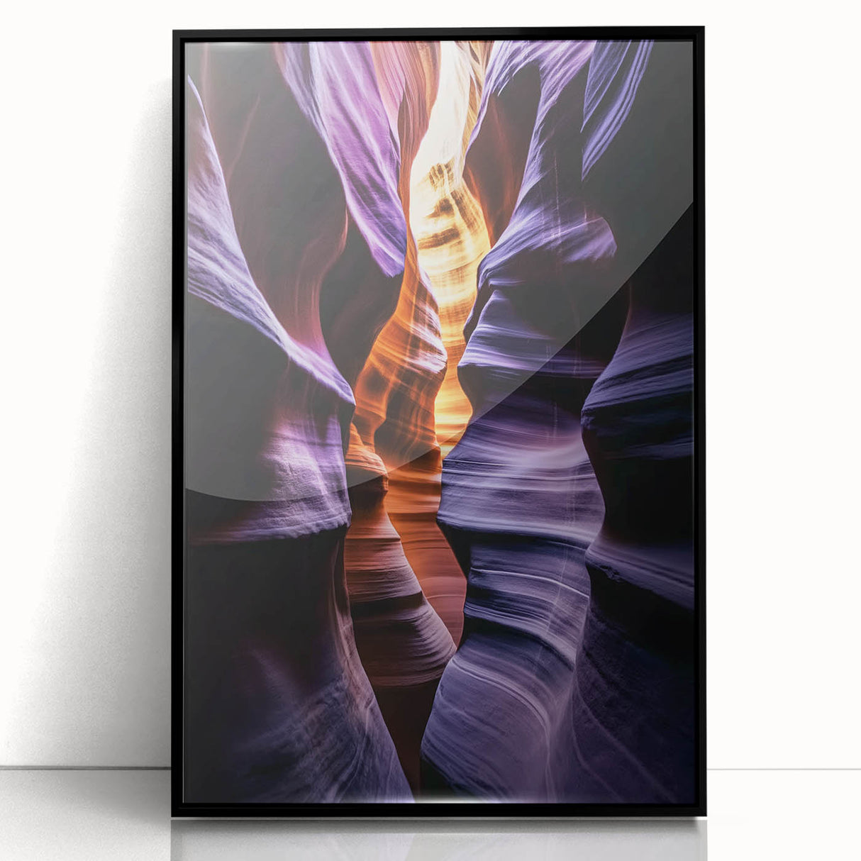 Framed acrylic artwork showcasing a vibrant landscape of canyons with striking colors, presented in a sleek black frame, ideal for modern home decor.
