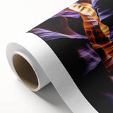 Vibrant rolled canvas artwork showcasing colorful canyon landscapes, featuring rich earth tones and intricate details, ideal for home decor or office aesthetics.