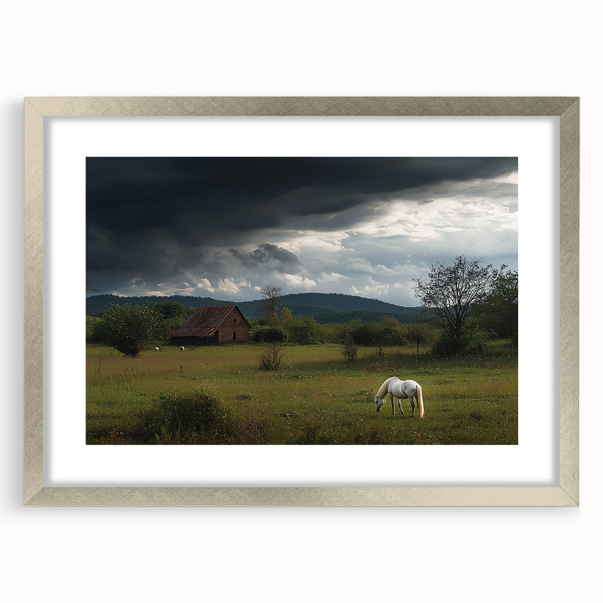 Silver-framed landscape print featuring a serene countryside scene with lush greenery and rolling hills, elegantly displayed with a mat for added sophistication.